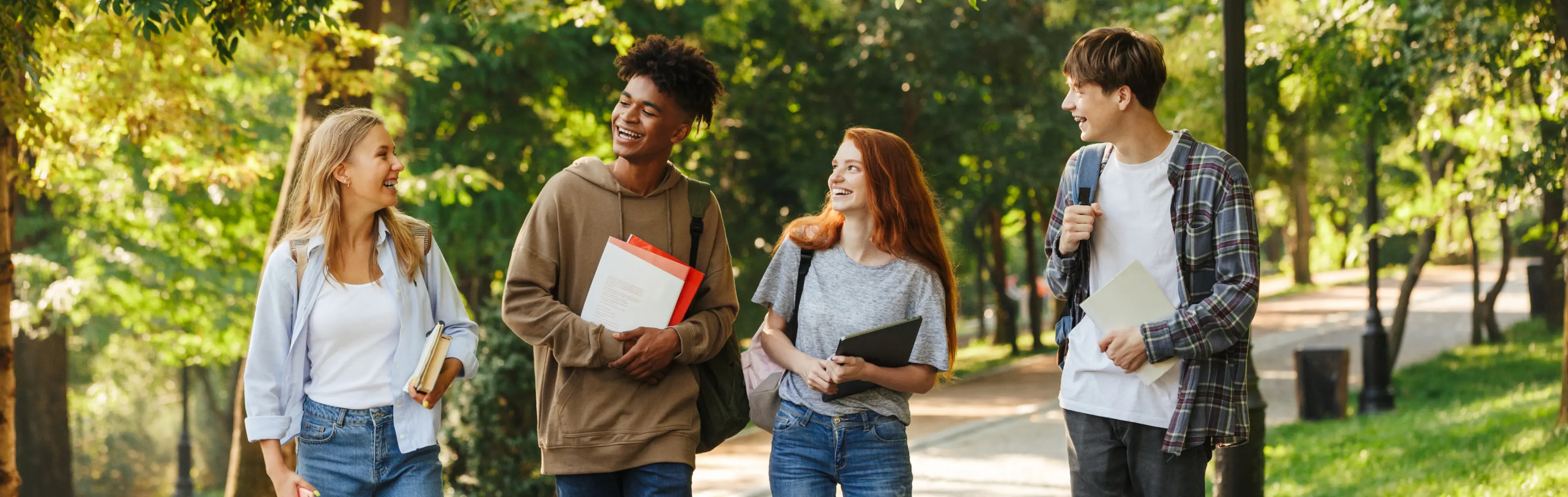 Group of Happy Students Walking on Campus