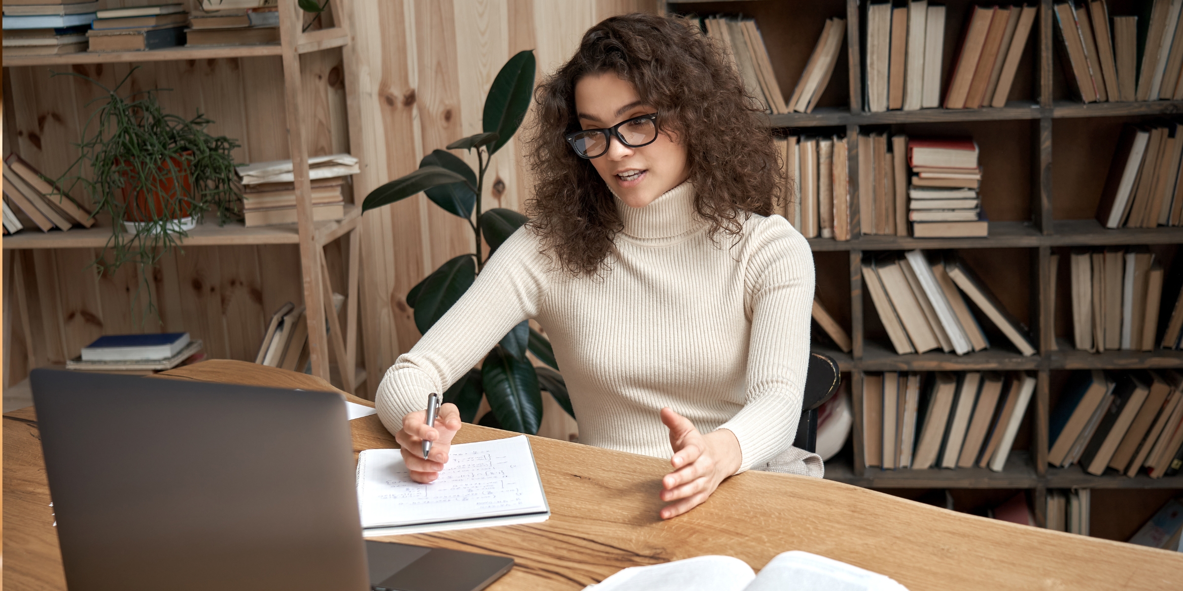 person in front of a laptop, talking