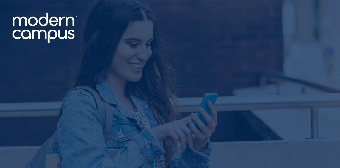 a young adult wearing a backpack and smiling at their phone